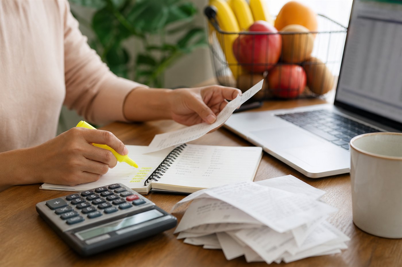 Reviewing grocery receipts and household expenses to cut monthly costs